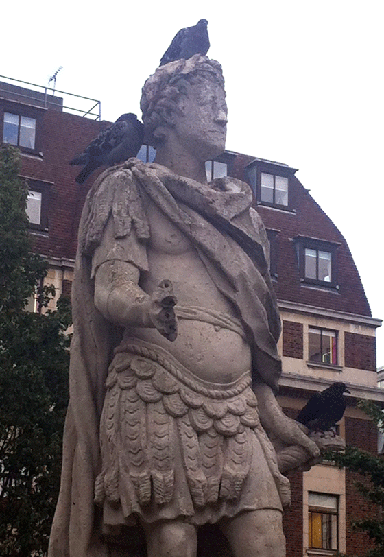 statue with pigeons